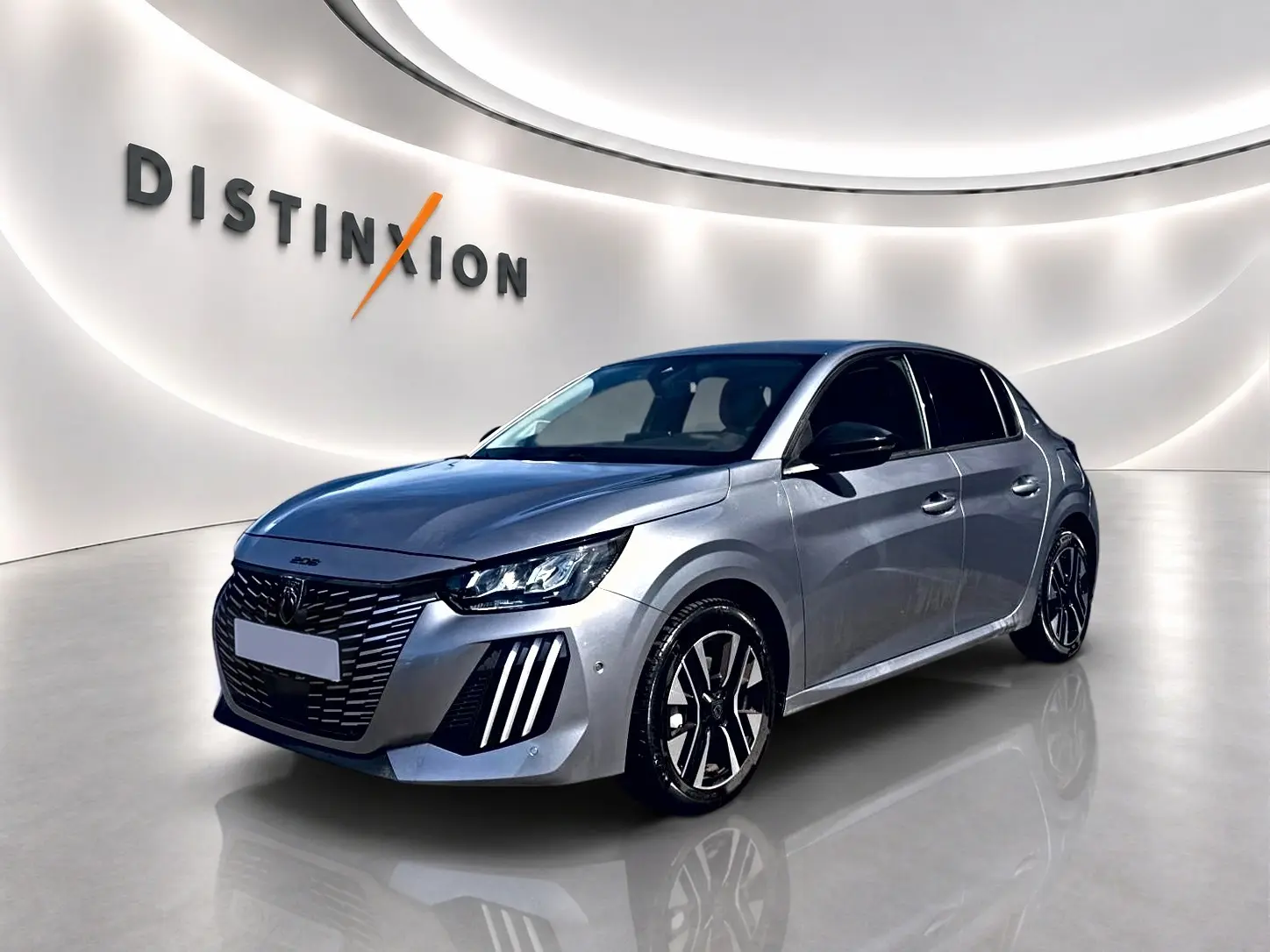 Peugeot 208 1.2 100 Allure gris Artense vue 3/4 avant avec phares LED et jantes alliage noires.