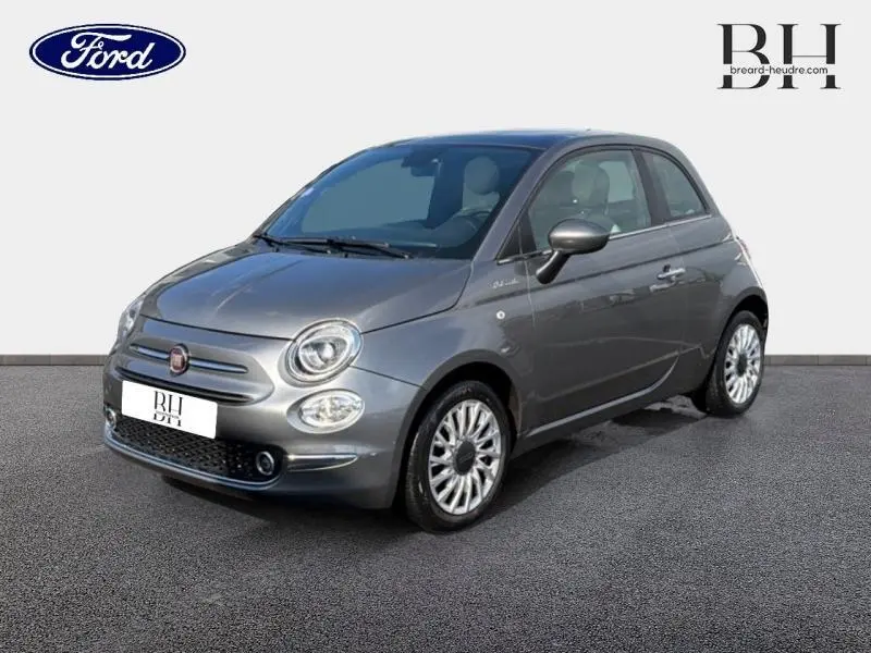 Fiat 500 Electroclash Grey Métal vue 3/4 avant droit, avec jantes alu et phares ronds caractéristiques.