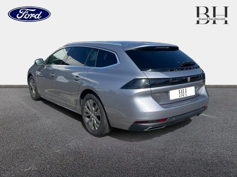 Peugeot 508 SW gris Artense vue 3/4 arrière droit avec vitres surteintées et jantes alliage