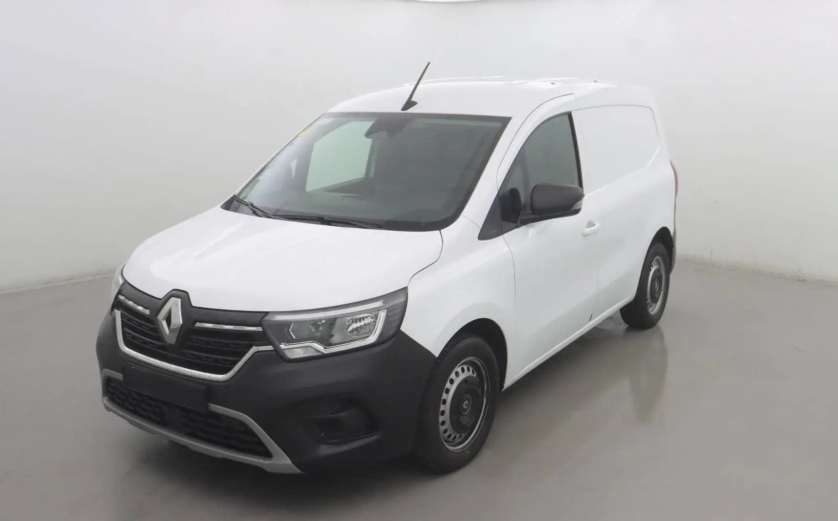Renault Kangoo Van blanc vue 3/4 avant droit, avec pare-chocs noir et jantes acier simples.