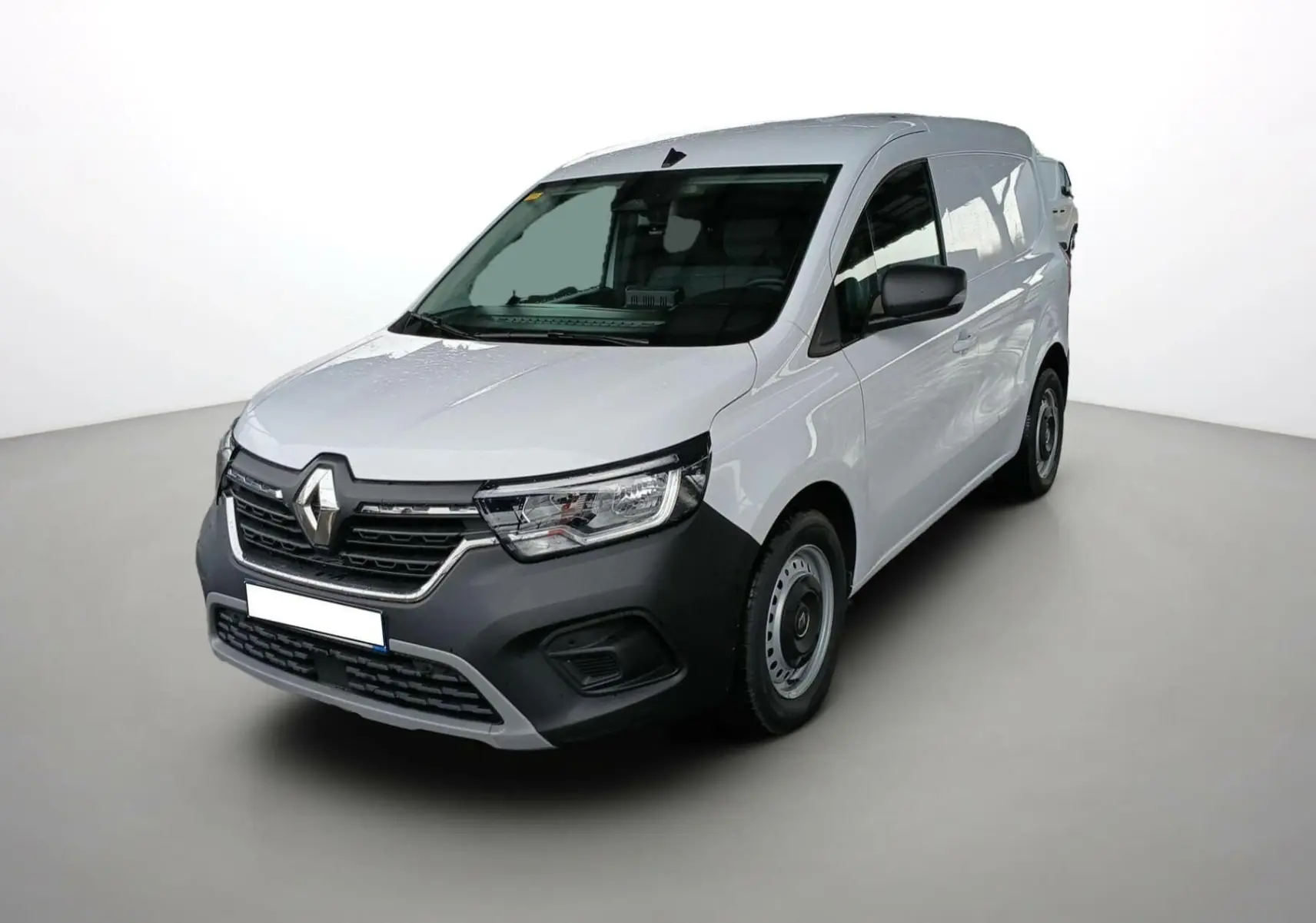 Renault Kangoo Van blanc vue 3/4 avant droit, avec pare-chocs noir et jantes acier simples.