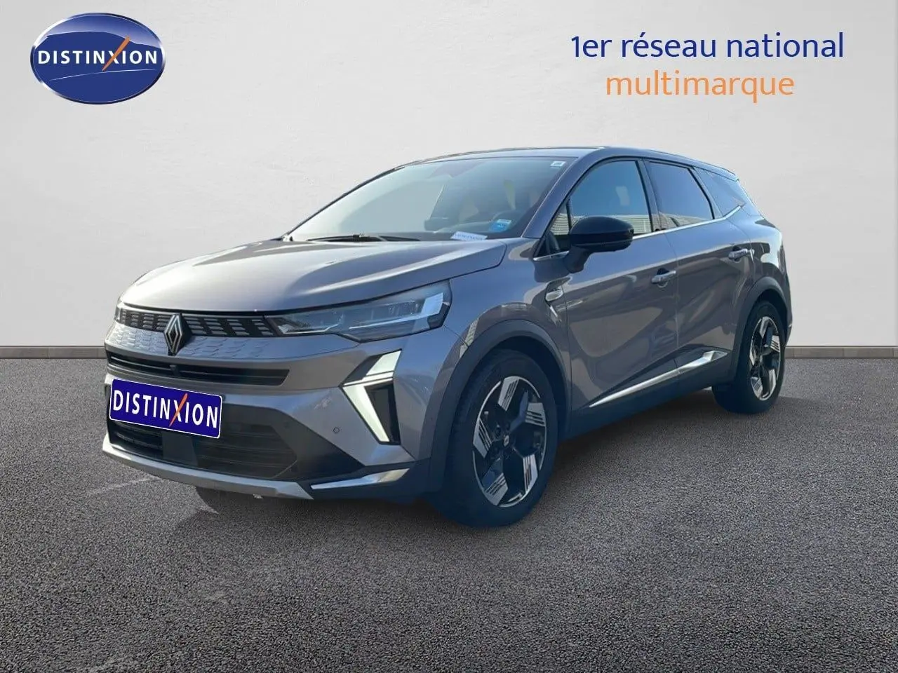 Renault Symbioz gris cassiopée métal, vue 3/4 avant droit, SUV hybride avec design moderne et jantes distinctives.