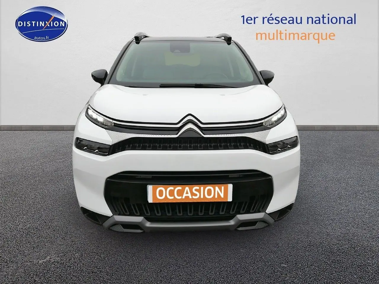 Citroën C3 Aircross blanc polar vue de face avec calandre noire et plaque "OCCASION" orange visible.