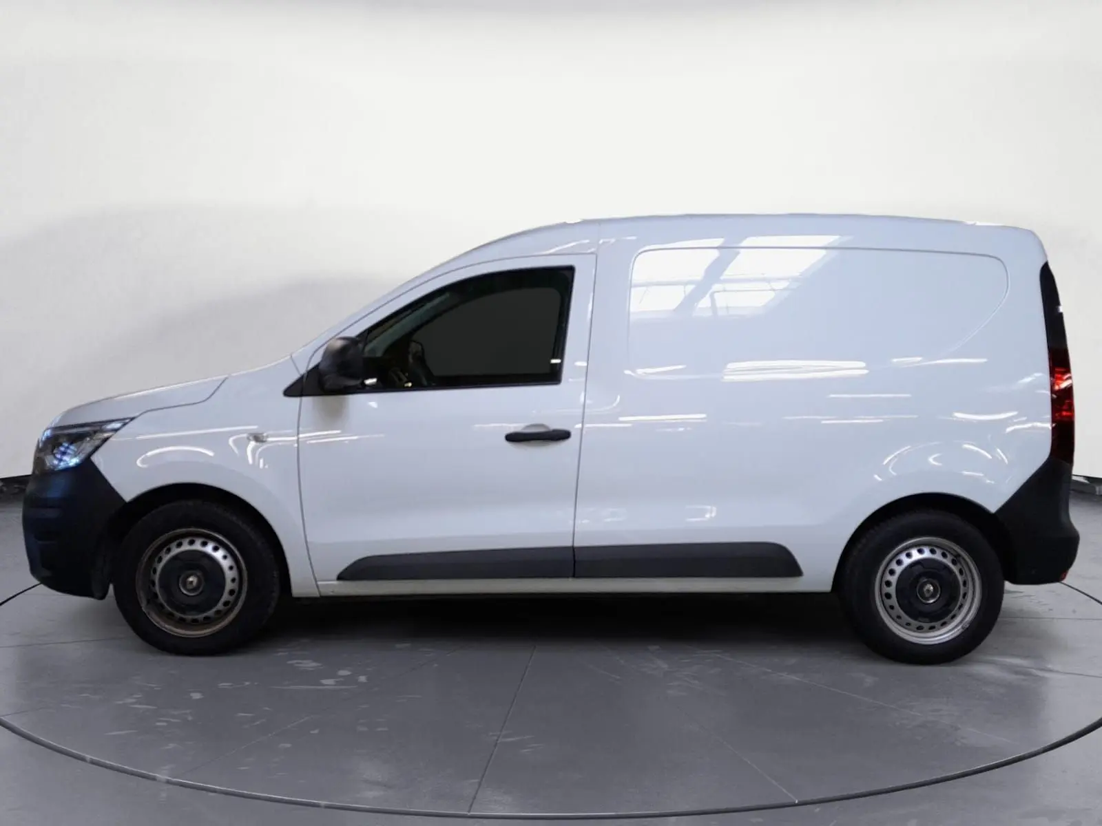 Profil côté gauche du Renault Express Van blanc 2023, version 1.5 Blue dCi 95 avec portes latérales et jantes acier.