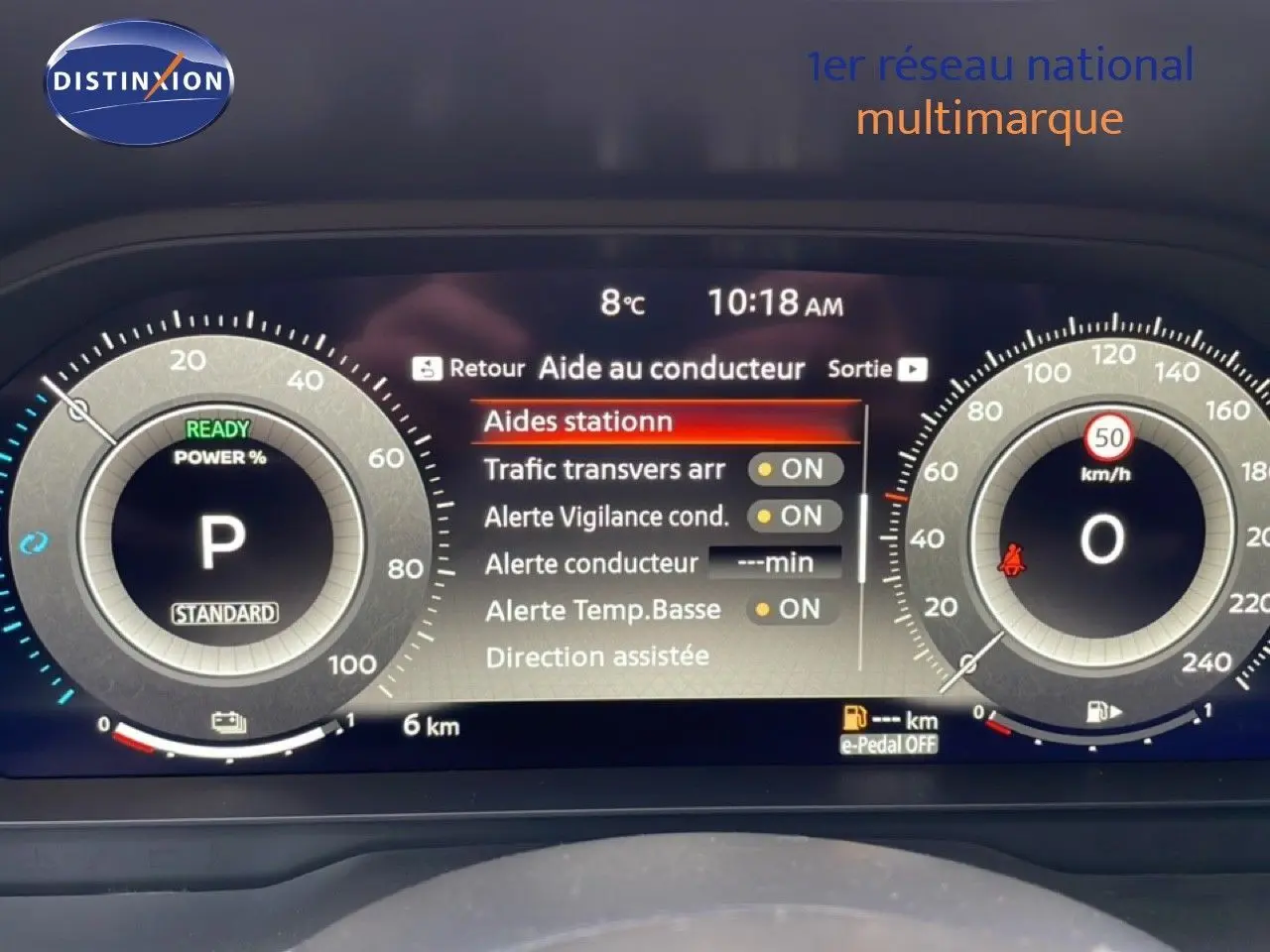 Tableau de bord numérique du Nissan Qashqai 1.5 E-POWER 2025 affichant les aides à la conduite et la vitesse à 0 km/h.