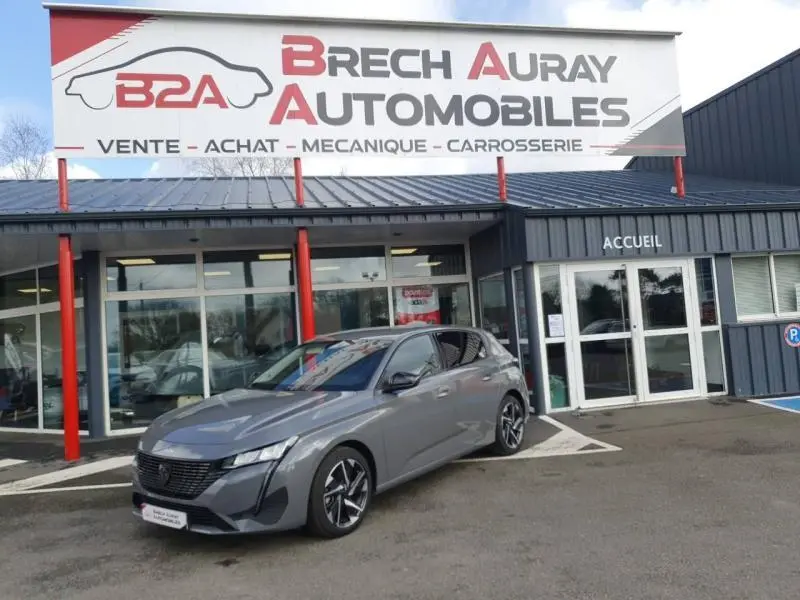 Peugeot 308 gris Sélénium vue 3/4 avant droit devant concession Brech Auray Automobiles.