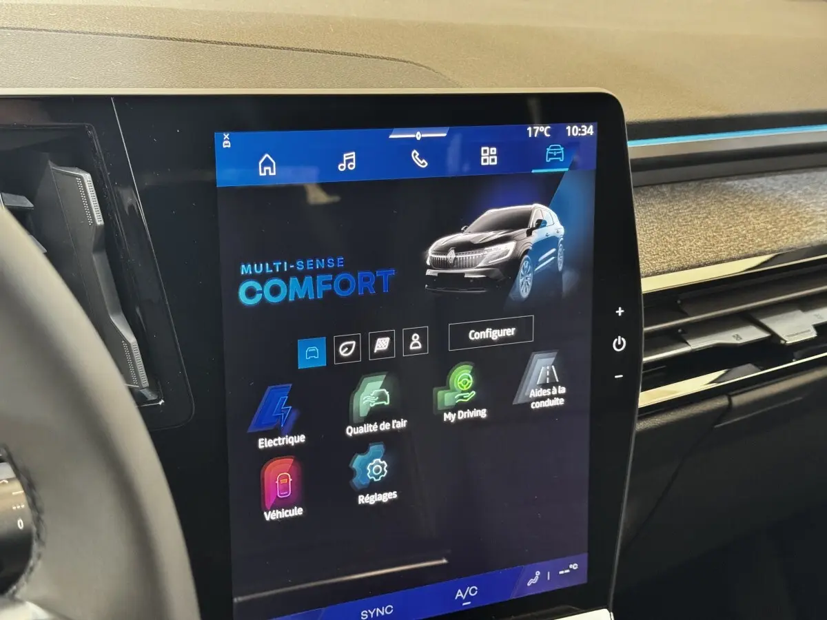 Écran tactile central affichant les modes de conduite du Renault Espace noir, vue intérieure du tableau de bord.