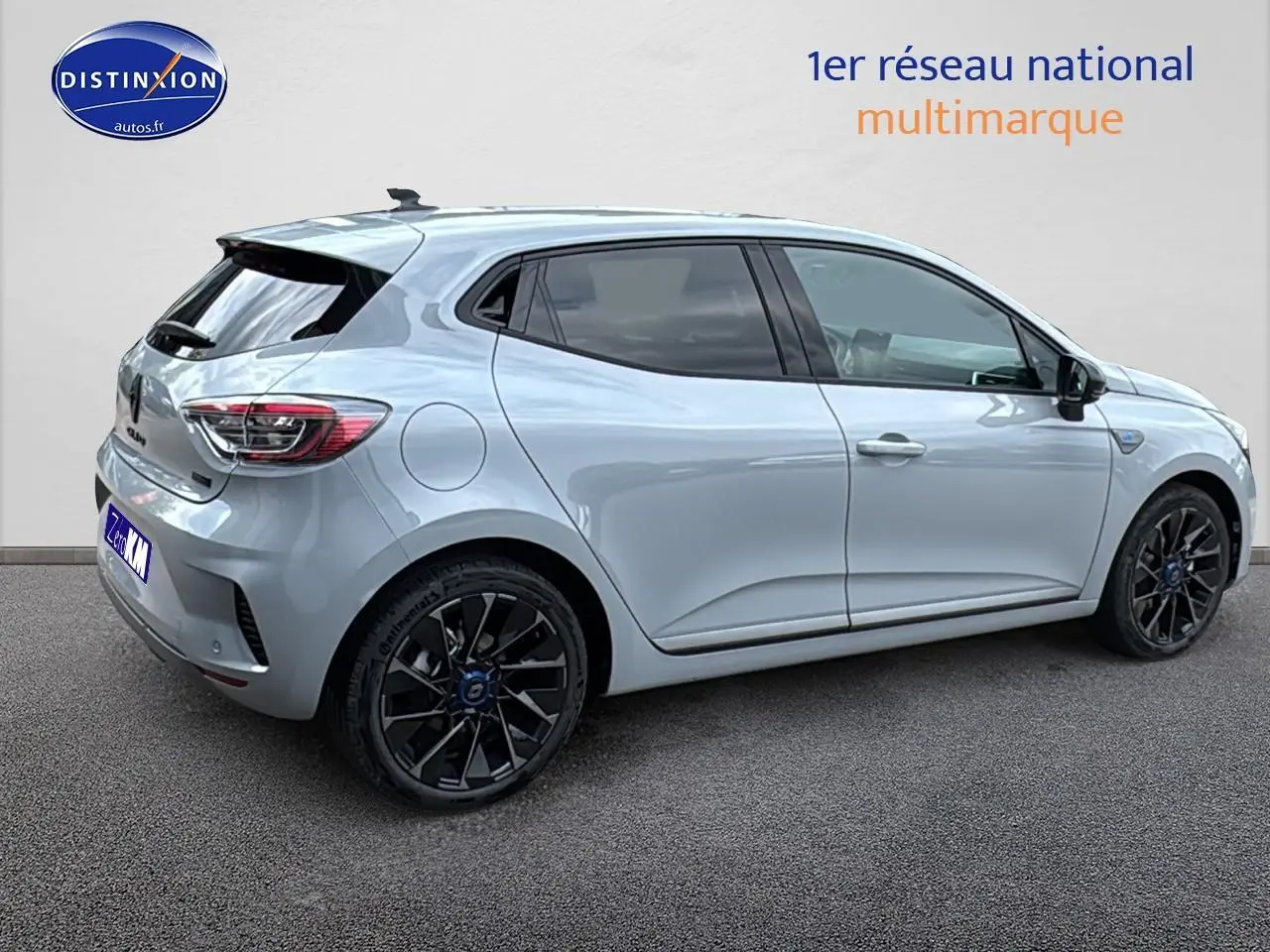 Renault Clio V gris rafale vue de profil côté droit, jantes alu noires esprit Alpine et feux arrière LED.