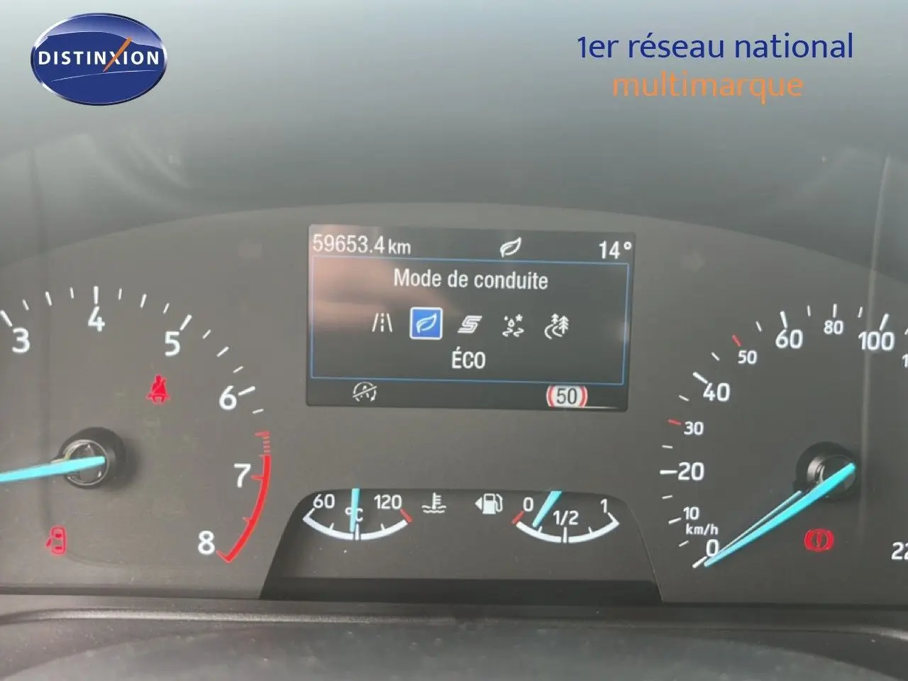 Tableau de bord du Ford Puma gris 2021, affichage du mode de conduite Éco et compteur kilométrique à 59 653 km.