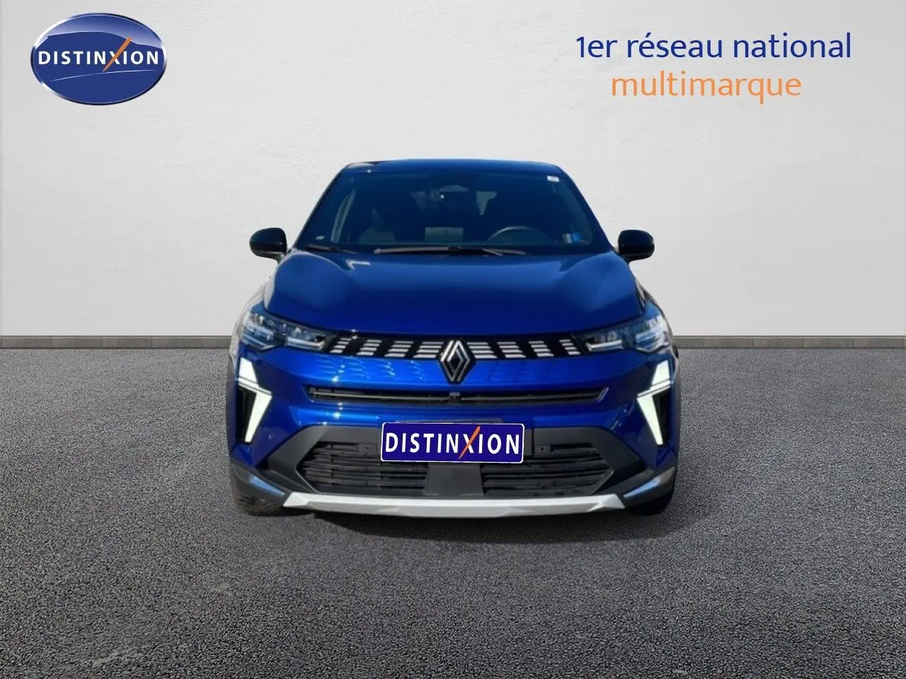 Vue avant d'une Renault Symbioz 2025 bleu iron metal avec calandre distinctive et feux LED verticaux.