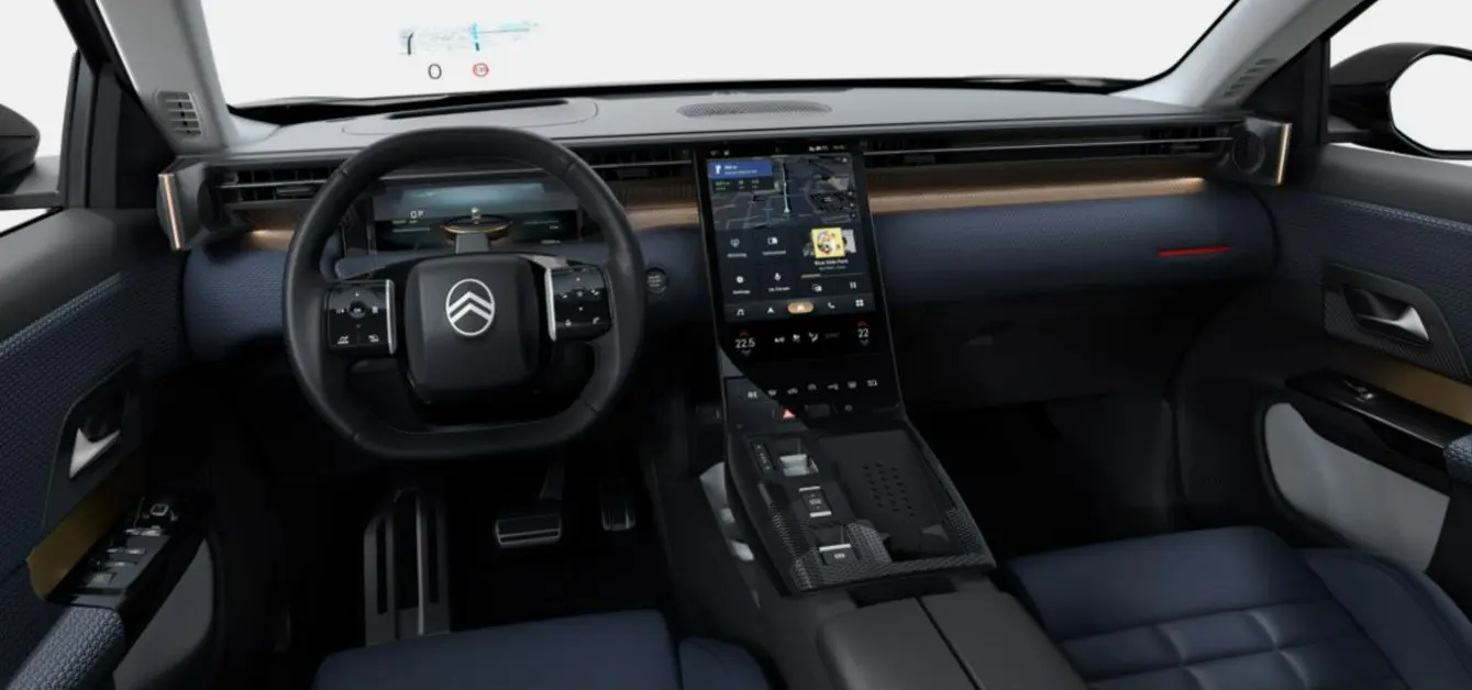Vue intérieure avant du Citroën C5 Aircross II Hybrid avec tableau de bord moderne et sièges bleu foncé.