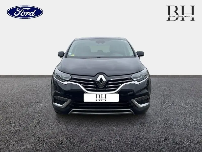 Vue avant d'un Renault Espace noir étoilé, mettant en valeur la calandre chromée et les phares LED.