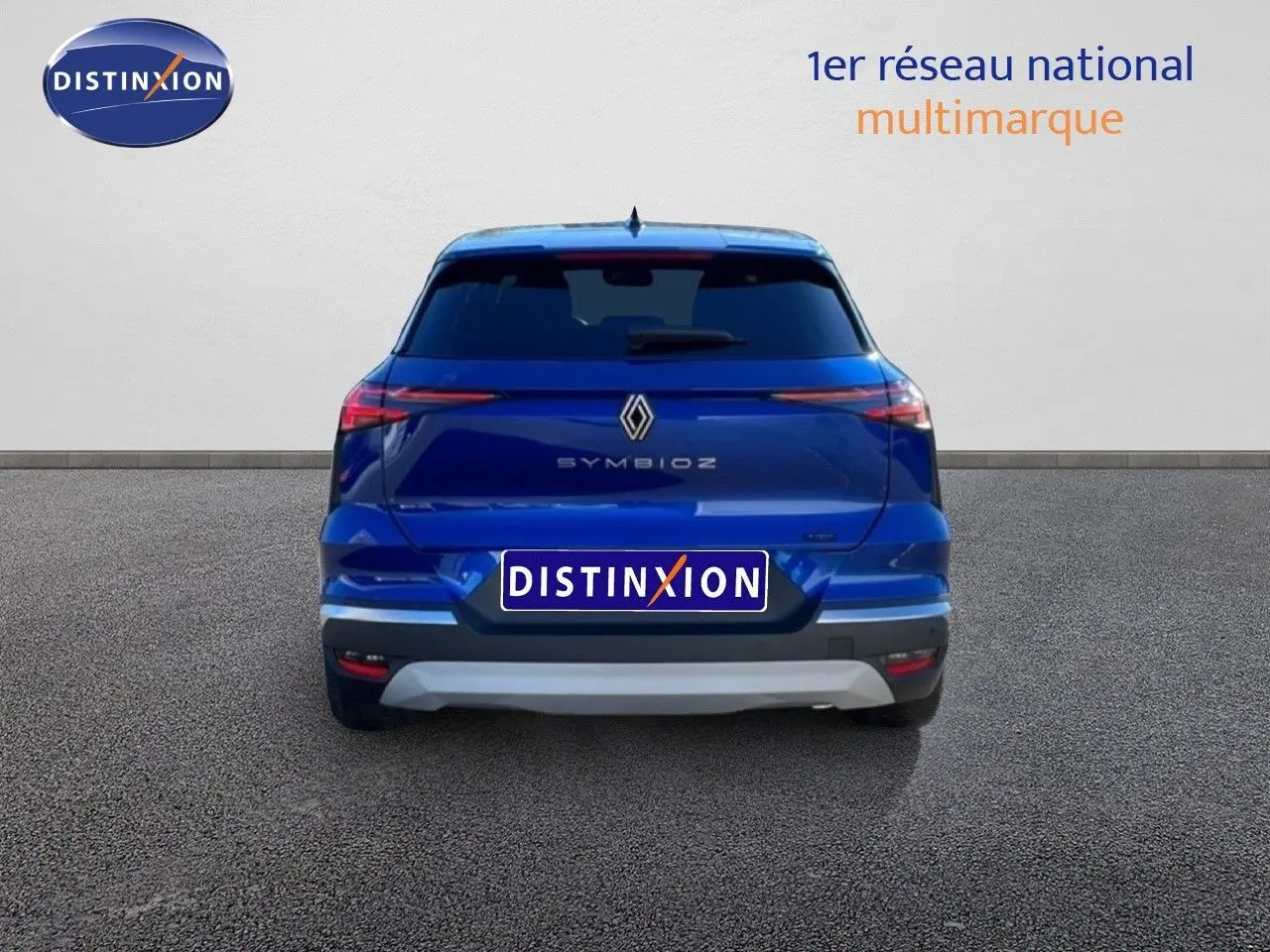 Vue arrière d'une Renault Symbioz bleu iron metal avec logo et feux LED fins sur fond neutre.
