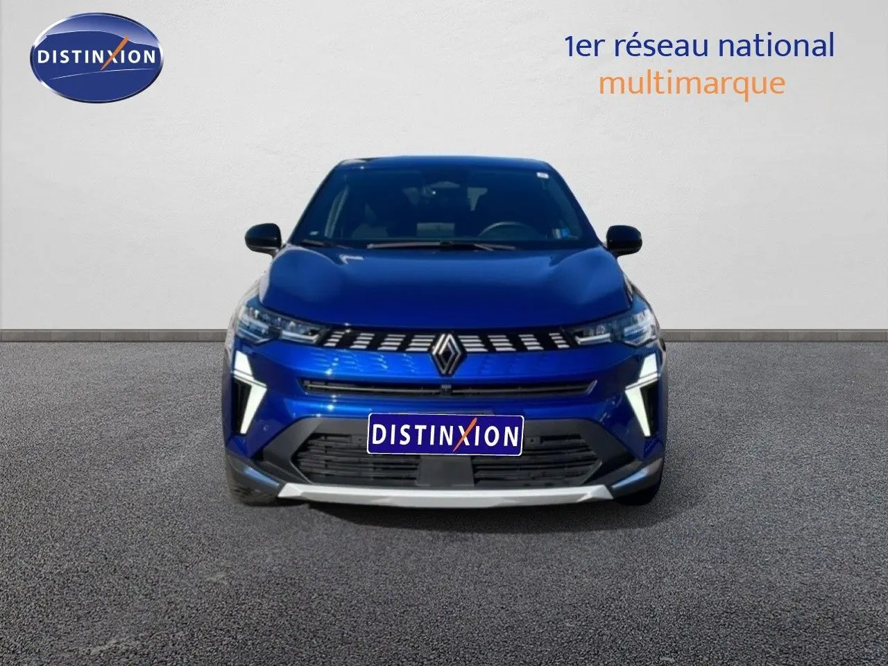 Vue frontale du Renault Symbioz bleu iron metal 2025 avec calandre distinctive et éclairage LED vertical.