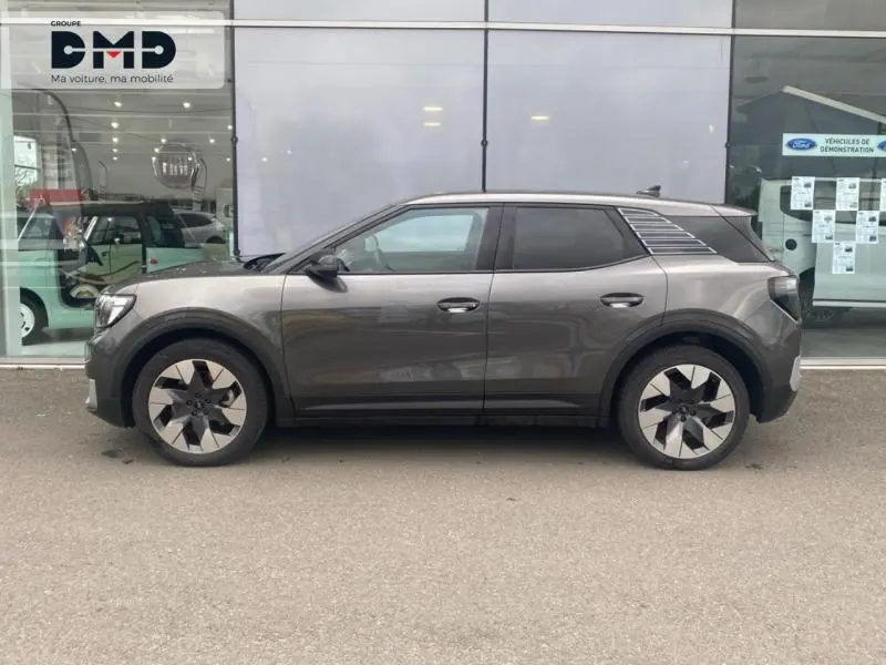 Vue latérale droite du Ford Explorer électrique 2025 en gris Magnetic métallisé, avec jantes alu distinctives.