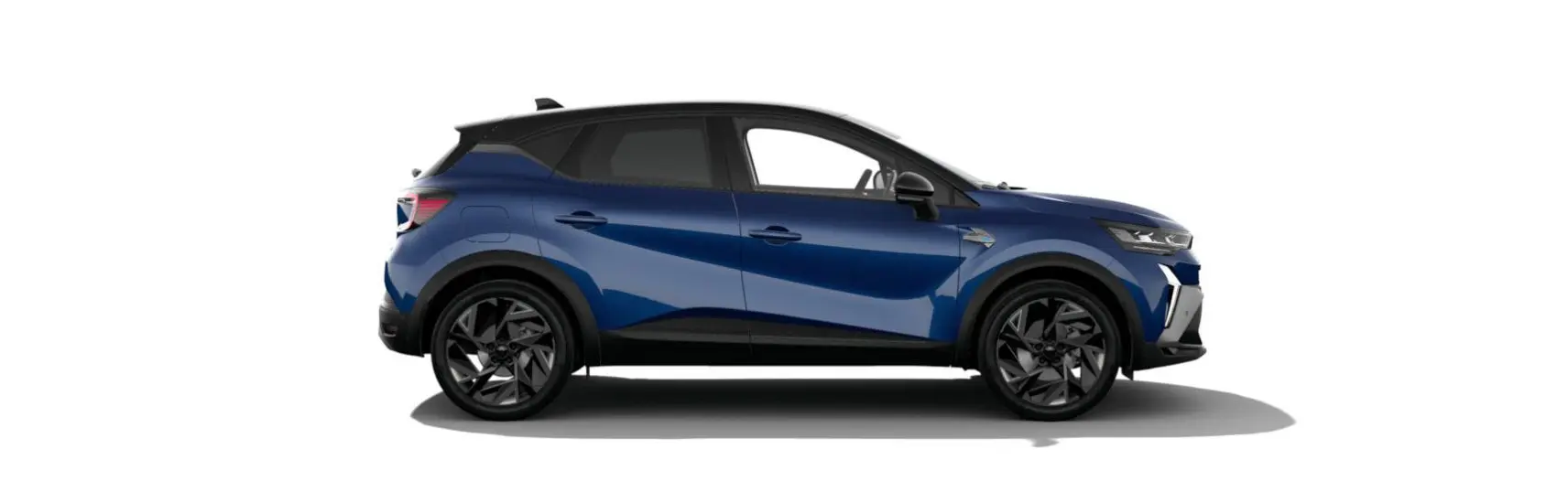 Profil côté gauche du Renault Captur 2025 hybride en bleu Iron avec toit noir étoilé et jantes noires.