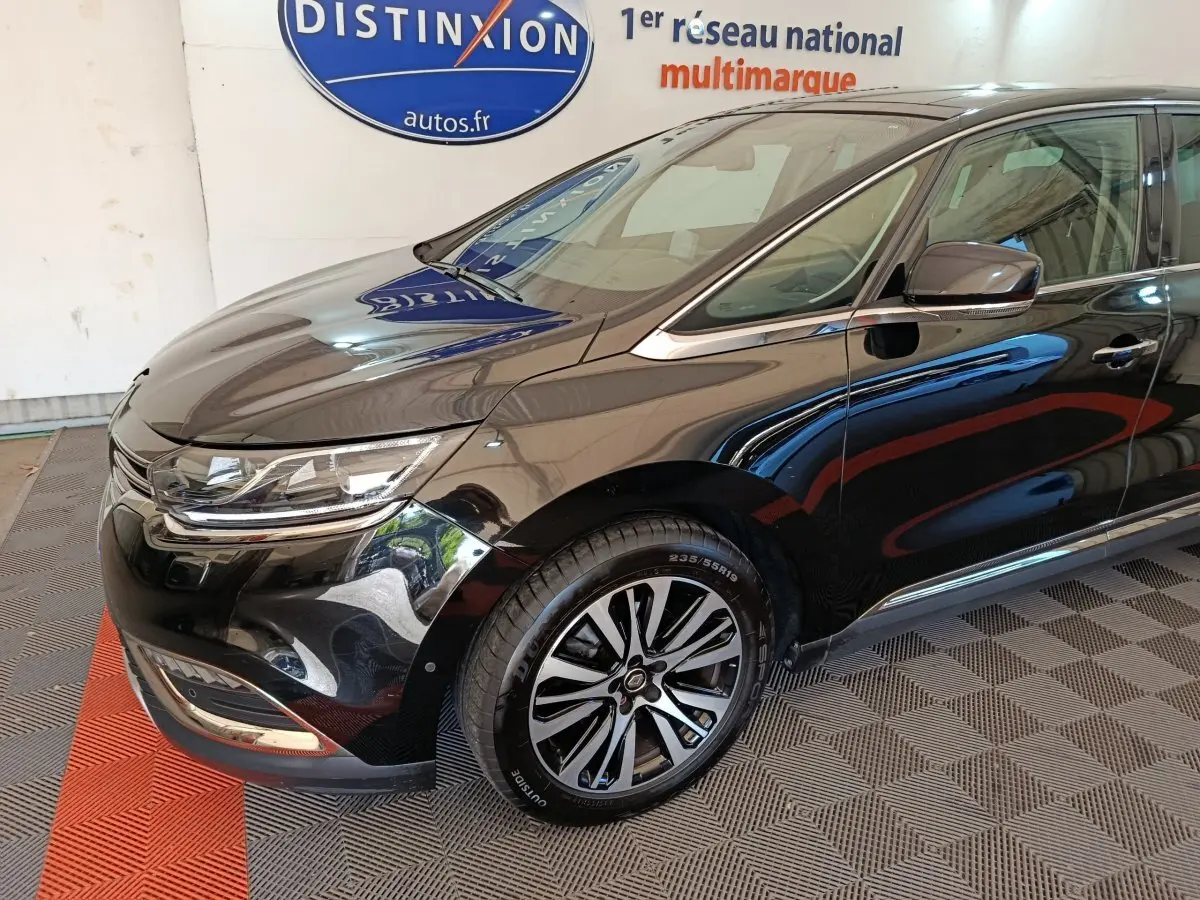 Vue 3/4 avant côté gauche d'un Renault Espace noir brillant avec jantes alliage et phares LED distinctifs.