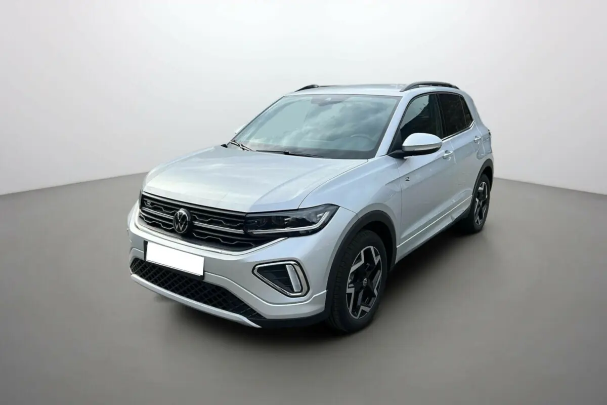 Volkswagen T-Cross TSI 116 DSG7 R-Line gris argent en 3/4 avant droit avec jantes alu 17 pouces et barres de toit.