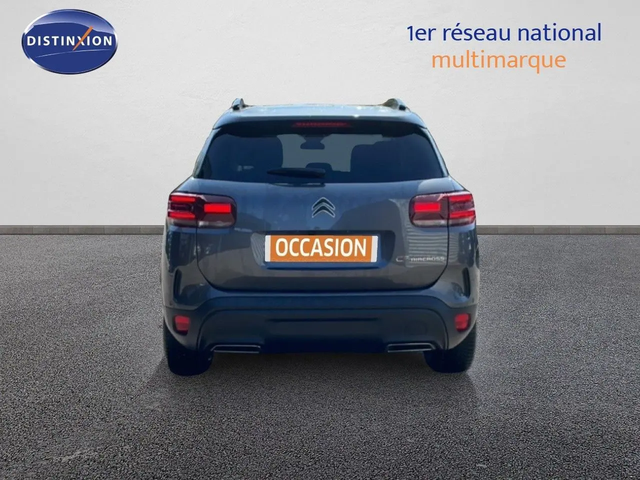Vue arrière d'un Citroën C5 Aircross gris platinium métal avec feux LED et plaque "OCCASION" visible.