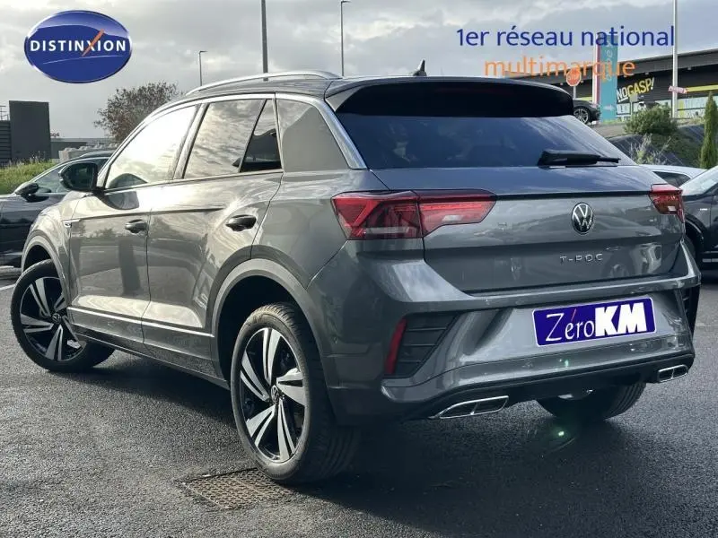 Volkswagen T-Roc gris 3/4 arrière droit, version R-Line Edition avec jantes alliage distinctives et feux LED.