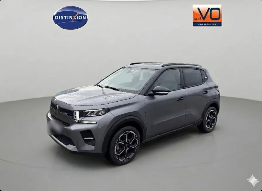 Citroën C3 Turbo 100 ch gris vue 3/4 avant droit avec jantes alliage et barres de toit visibles.