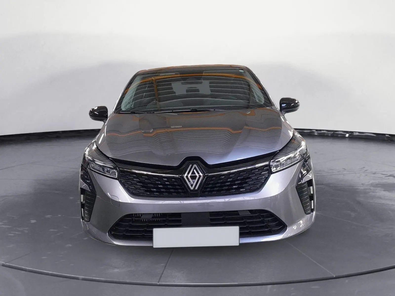 Renault Clio V gris schiste vue de face, mettant en valeur la calandre noire et les phares LED Pure Vision.