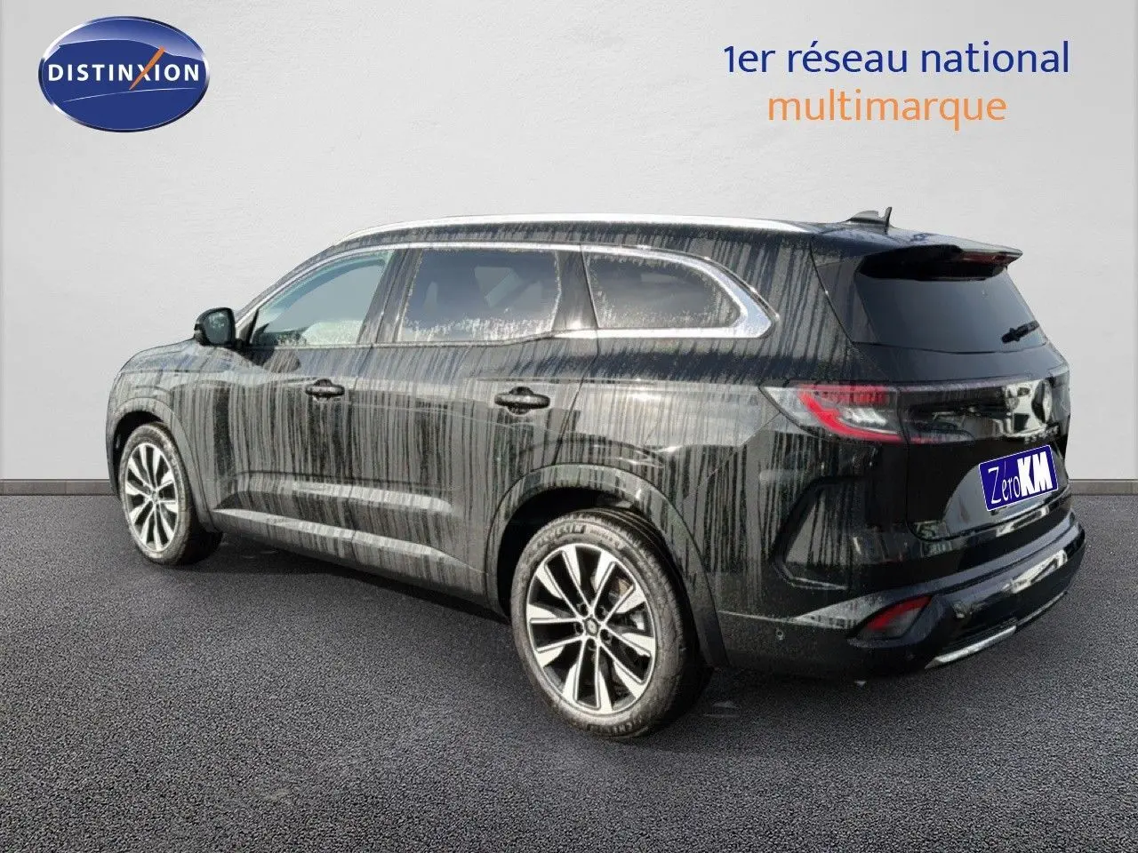 Renault Espace noir étoile métal vu de trois quarts arrière droit, SUV familial avec jantes alliage et vitres teintées.