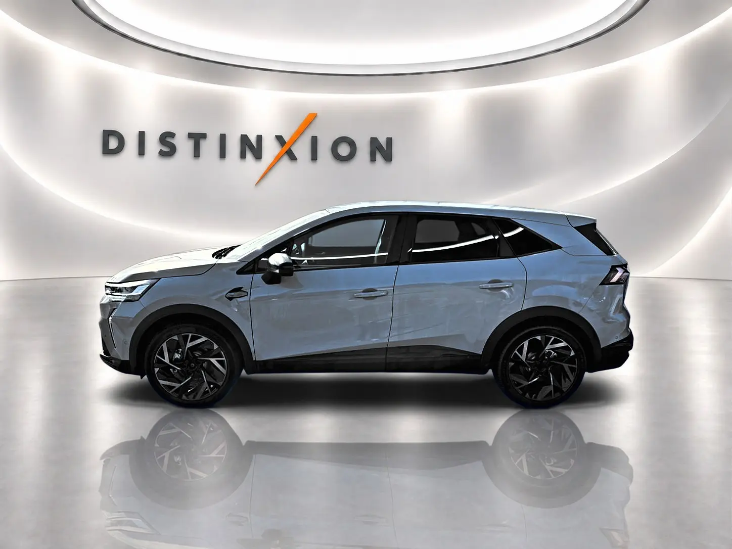 Vue latérale droite du Renault Symbioz gris rafale, avec jantes noires et toit noir contrastant.