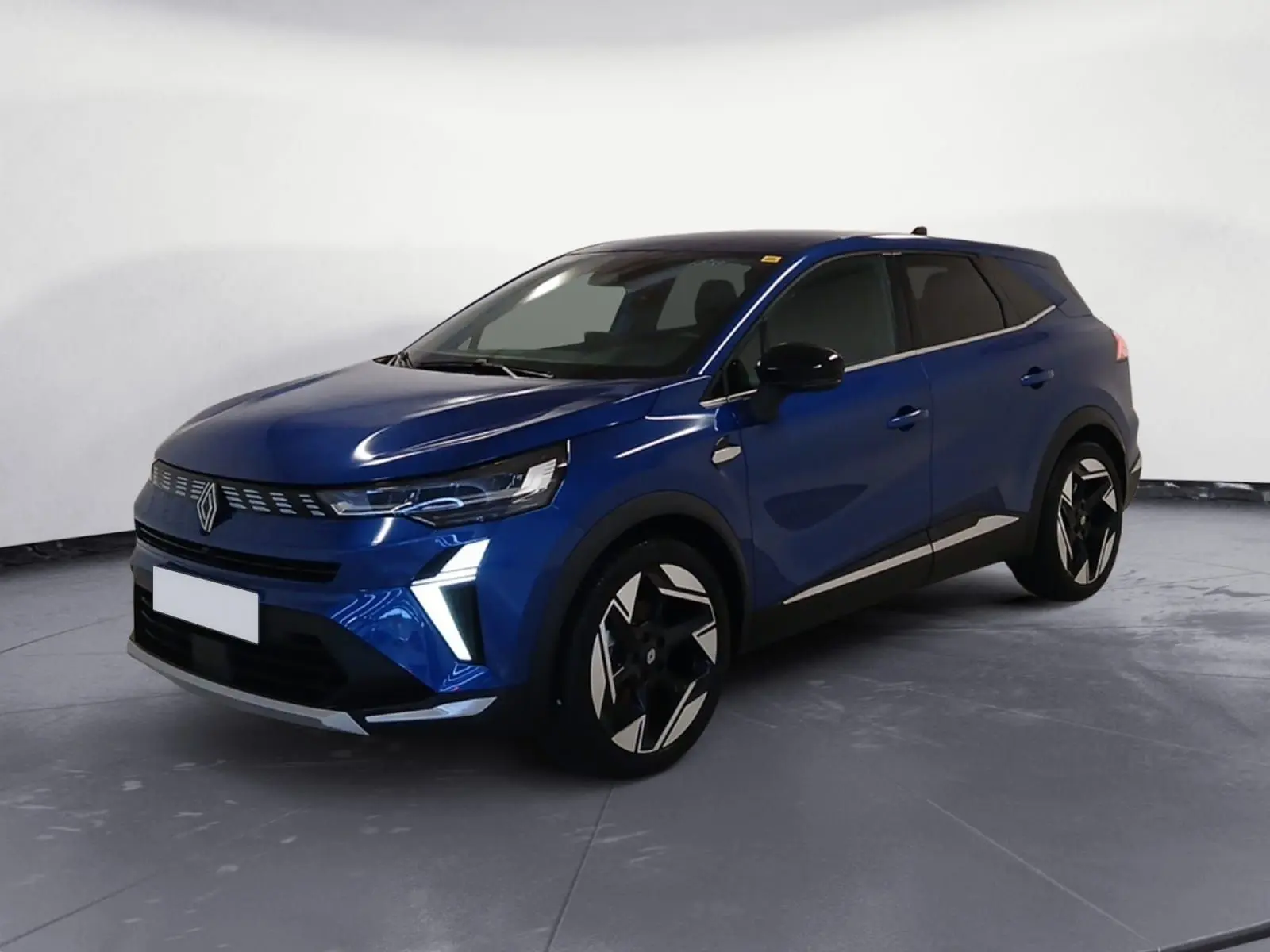 Renault Symbioz E-Tech Full Hybrid 145 Iconic 2025 en bleu iron, vue 3/4 avant avec feux LED en forme de V.