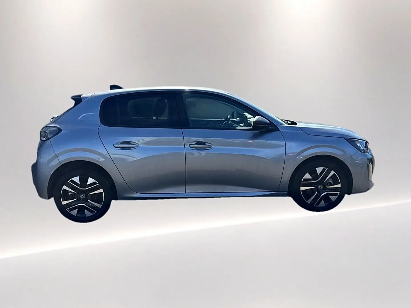 Peugeot 208 1.2 100 Allure gris artense vue de profil côté gauche avec jantes alliage noires et grises.