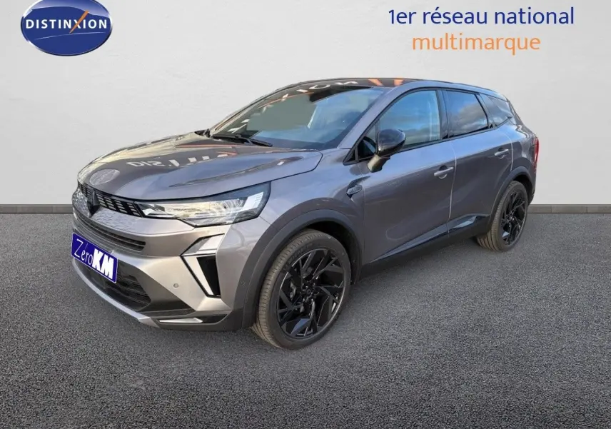 Renault Symbioz gris Cassiope en 3/4 avant droit, SUV hybride avec jantes noires et lignes modernes.