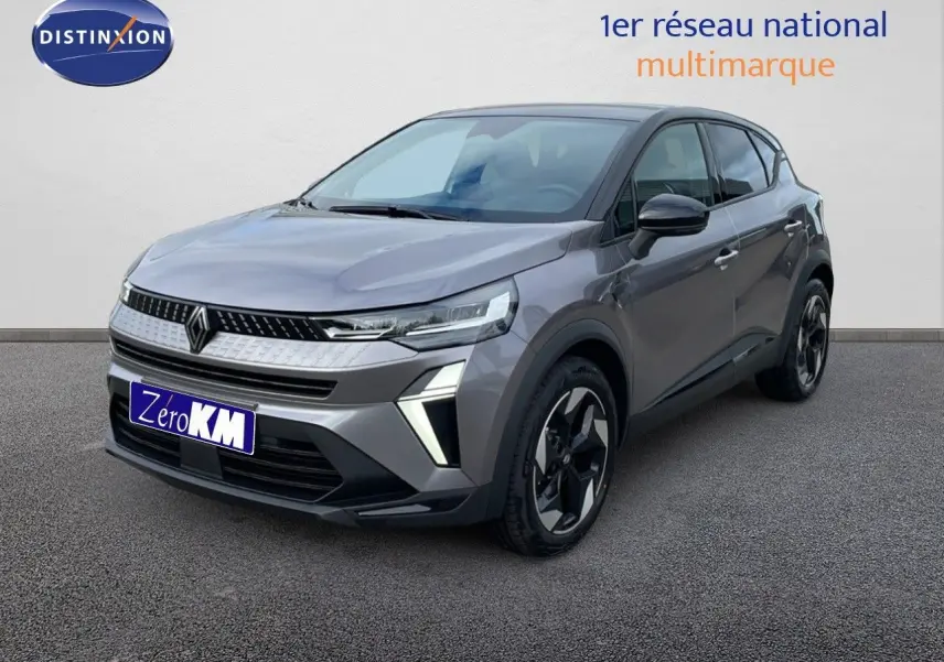 Renault Captur 2025 gris cassiopée métal avec toit noir, vue 3/4 avant mettant en valeur ses phares LED et jantes biton.