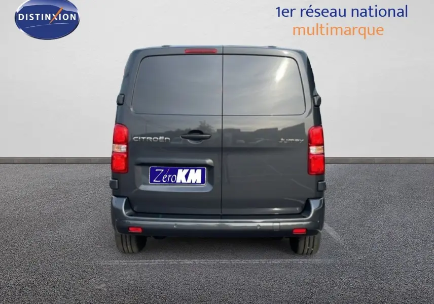 Vue arrière d'un Citroën Jumpy Cabine Approfondie gris titane métal avec portes battantes et feux rouges verticaux.