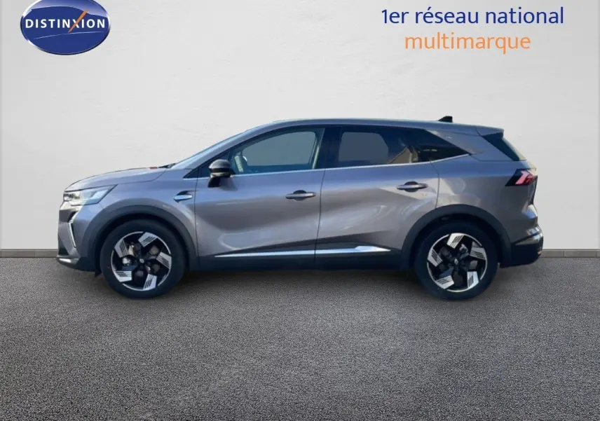 Profil droit du Renault Symbioz gris cassiopée métallisé, mettant en valeur ses lignes modernes et ses jantes stylisées.