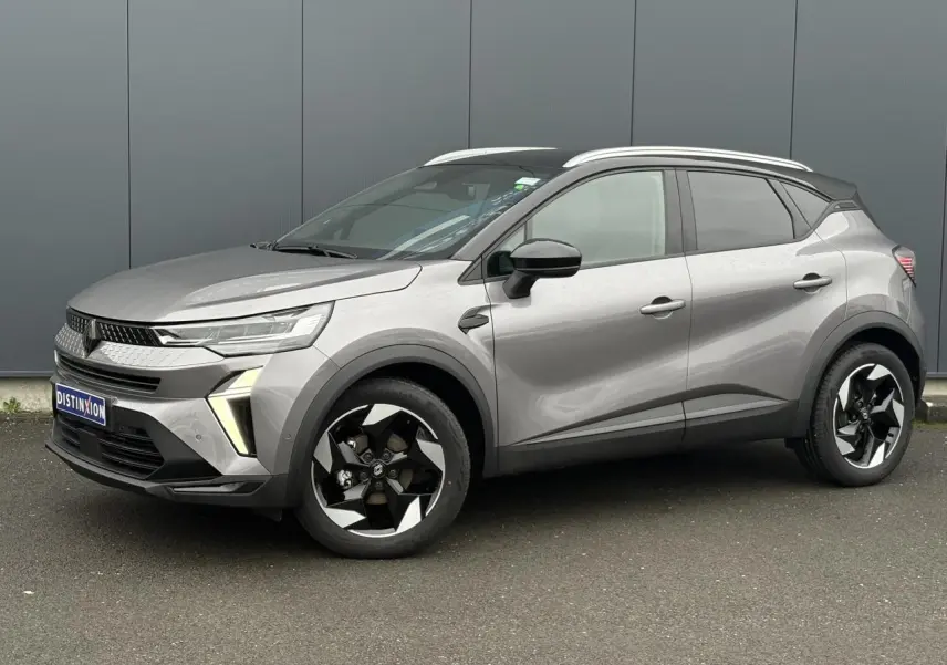 Renault Captur TCE 100 Techno gris Cassiopée/Noir en 3/4 avant droit, avec jantes alu diamantées noires et railing de toit alu.