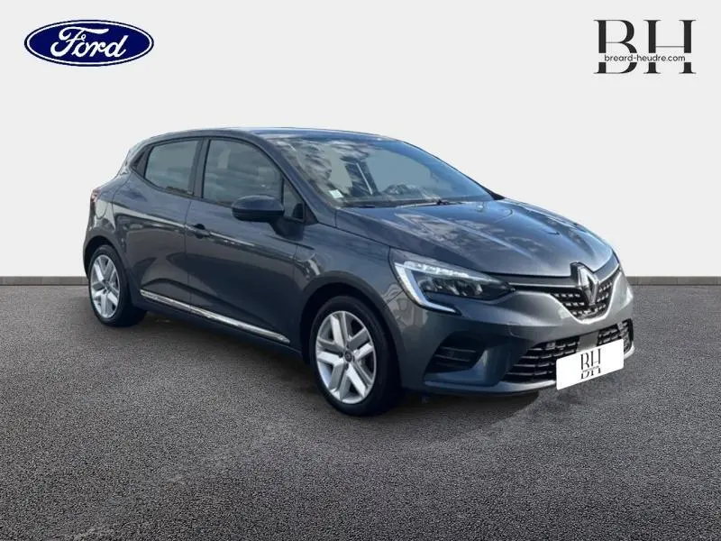 Renault Clio gris titanium vue 3/4 avant droit avec phares LED et jantes alliage cinq branches