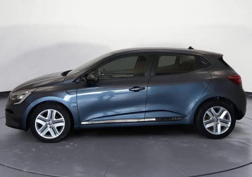 Renault Clio V TCe 100 Business gris foncé vue de profil côté gauche, avec jantes alliage et lignes épurées.