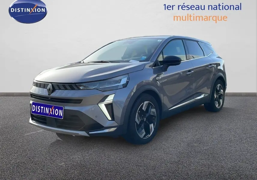 Renault Symbioz gris cassiopée métal, vue 3/4 avant droit, SUV hybride avec design moderne et jantes distinctives.