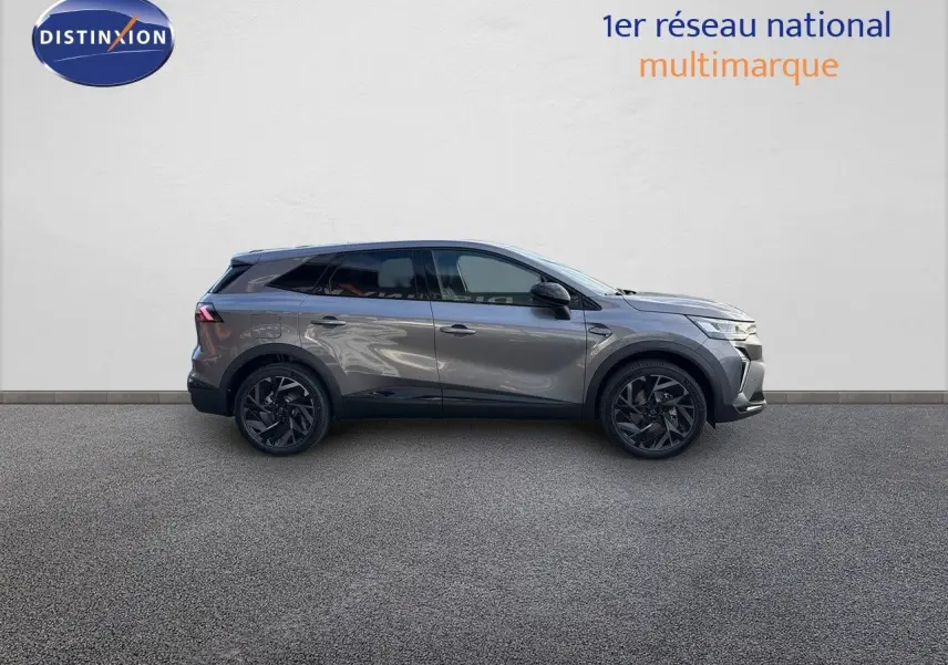 Profil droit du Renault Symbioz gris cassiopée métal 2024 avec jantes noires et lignes modernes.