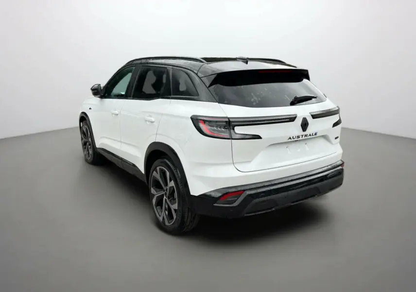 Renault Austral E-Tech 200 Esprit Alpine Plus blanc nacré, vue 3/4 arrière côté gauche avec toit noir.