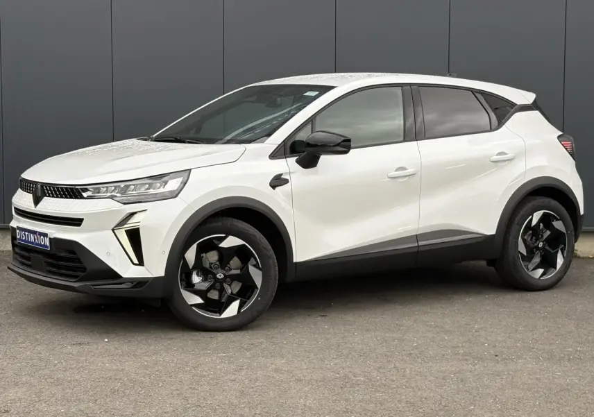 Vue de profil droit du Renault Captur blanc nacré 2026 avec jantes noires et détails noirs contrastants.