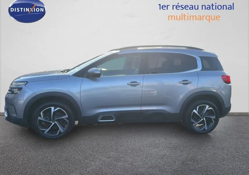 Profil droit du Citroën C5 Aircross gris Artense métal, SUV compact avec jantes alliage bicolores.