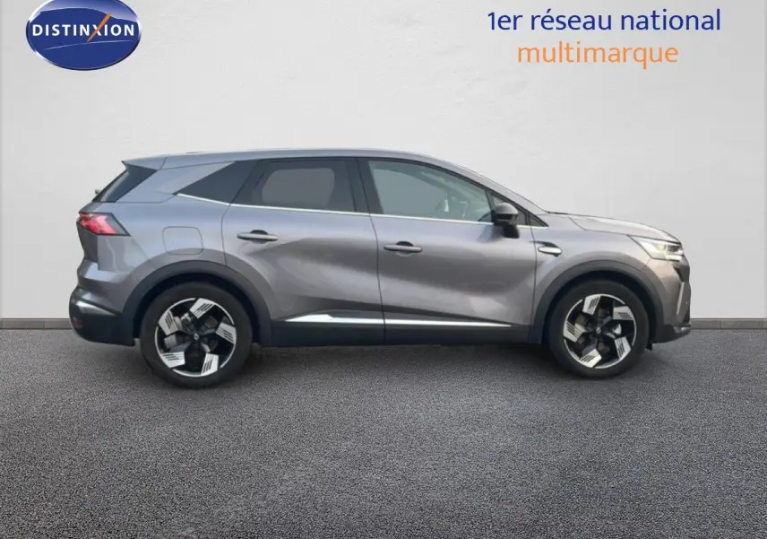 Profil droit du Renault Symbioz 2025 gris cassiopée métal avec jantes bicolores et lignes sculptées.