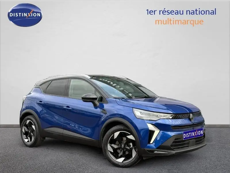 Renault Captur 2025 bleu Iron avec toit noir, vue 3/4 avant mettant en valeur ses jantes noires et détails modernes.