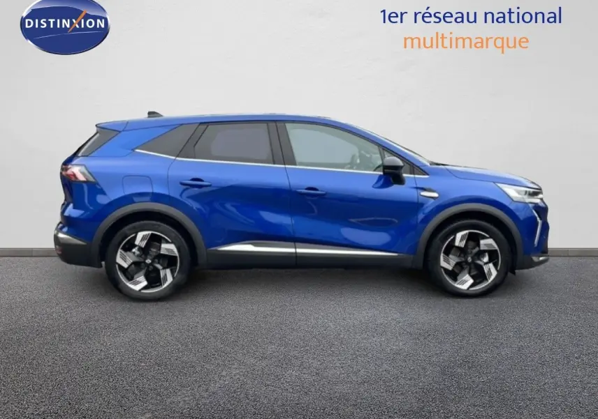 Profil droit d'un Renault Symbioz 1.6 E-Tech Full Hybrid 145ch Iconic en bleu Iron Metal, avec jantes alliage distinctives.