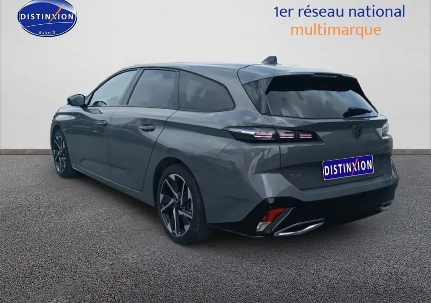 Peugeot 308 SW gris sellenium vue 3/4 arrière droit avec jantes alliage et vitres surteintées.