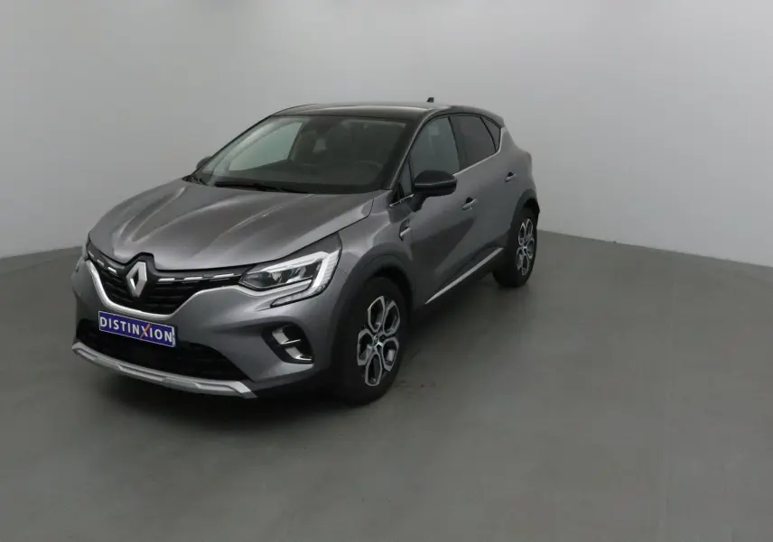 Renault Captur 2024 gris Cassiopée avec toit noir, vue 3/4 avant droit dans un studio neutre.