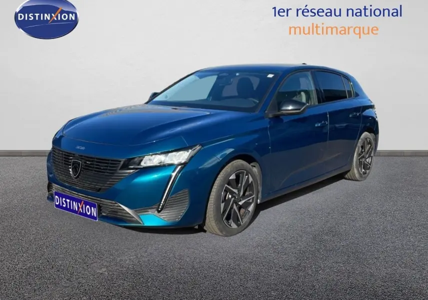 Peugeot 308 bleu obsession métal vue 3/4 avant droit avec signature lumineuse LED distinctive.