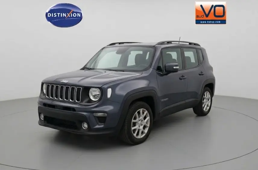 Jeep Renegade bleu en 3/4 avant droit, avec barres de toit et jantes alliage 17 pouces visibles.