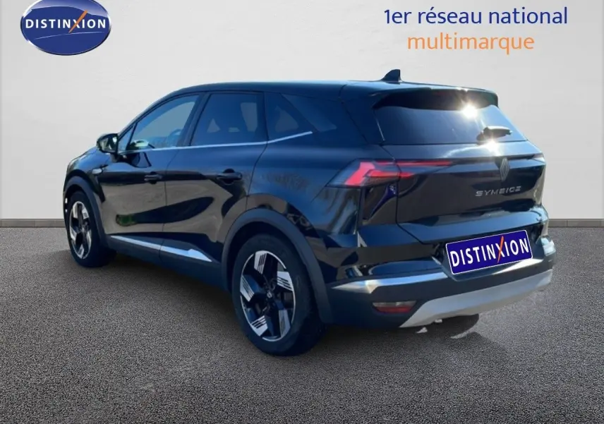 Renault Symbioz noir étoile métal, vue 3/4 arrière droit, avec feux LED et jantes bicolores distinctives.